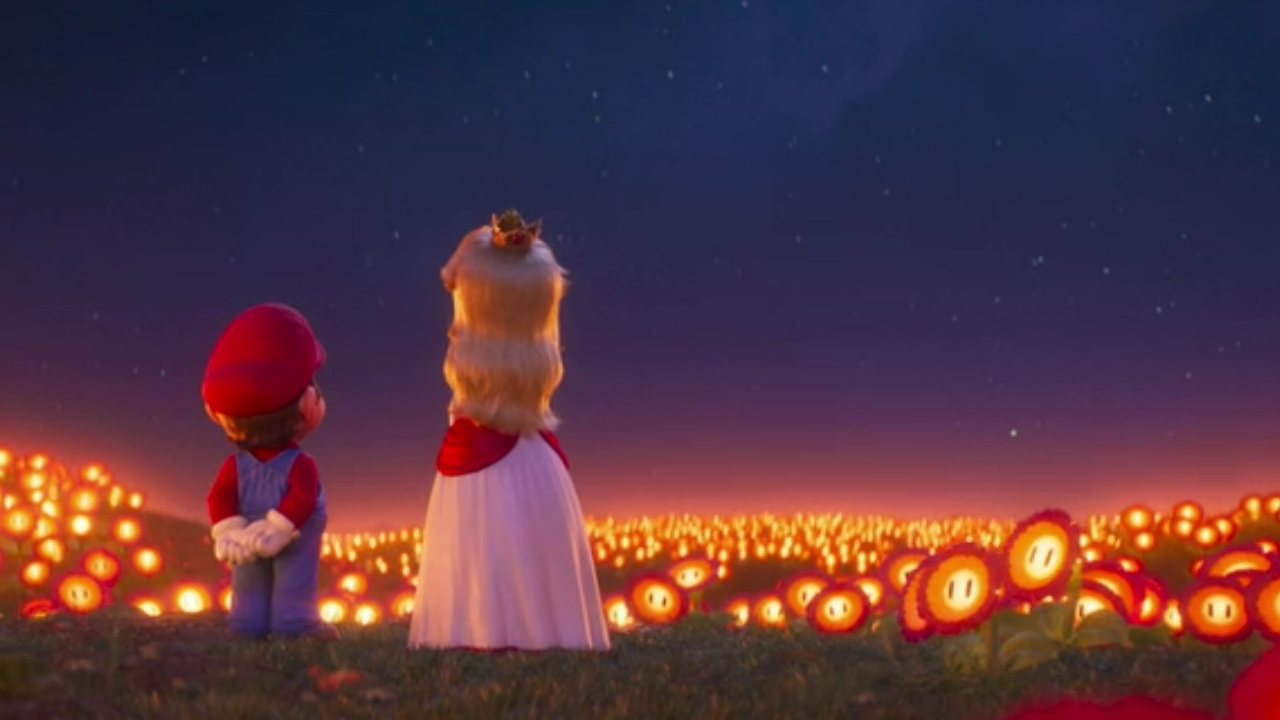 Still from The Super Mario Bros. Movie, wherein Mario & Princess Peach stand in a field of softly-glowing Fire Flowers beneath a starry night sky.