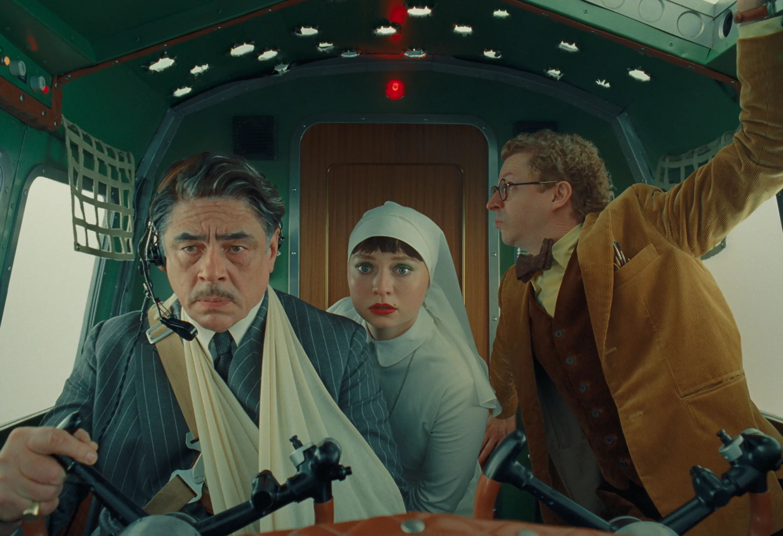 Korda, Liesl and Bjorn in the cockpit of a plane while being shot by a fighter jet.