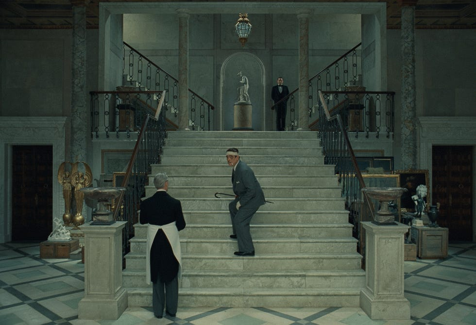Korda is seen going up a big set of stairs, ducking from one of his adopted sons shooting arrows at him with a crossbow.