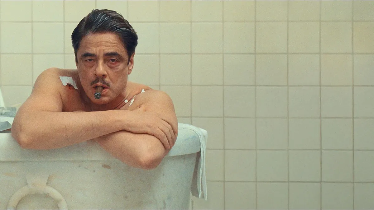 Korda leaning over the border of his bathtub.