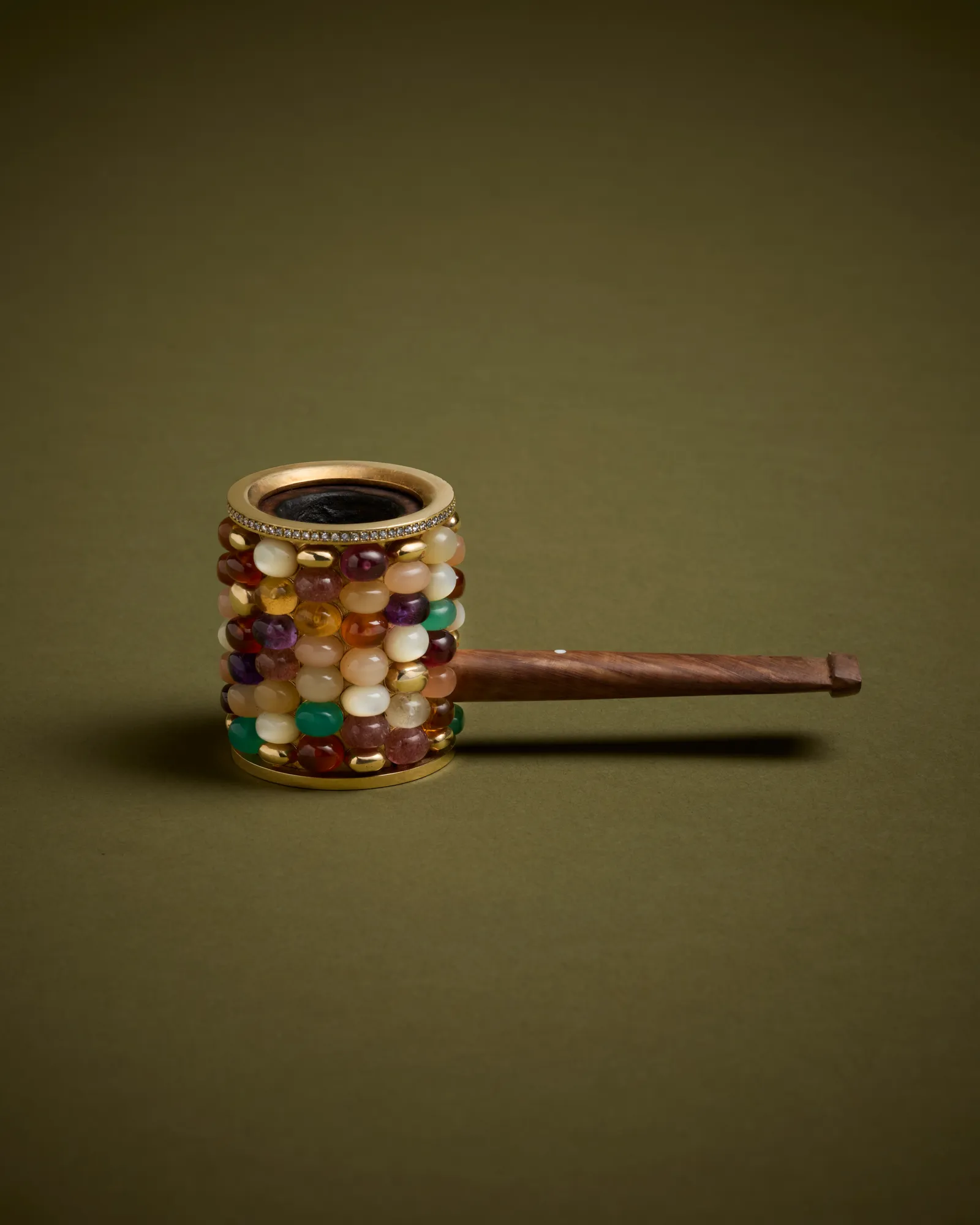 Liesl's pipe. Korda gifts it to her.