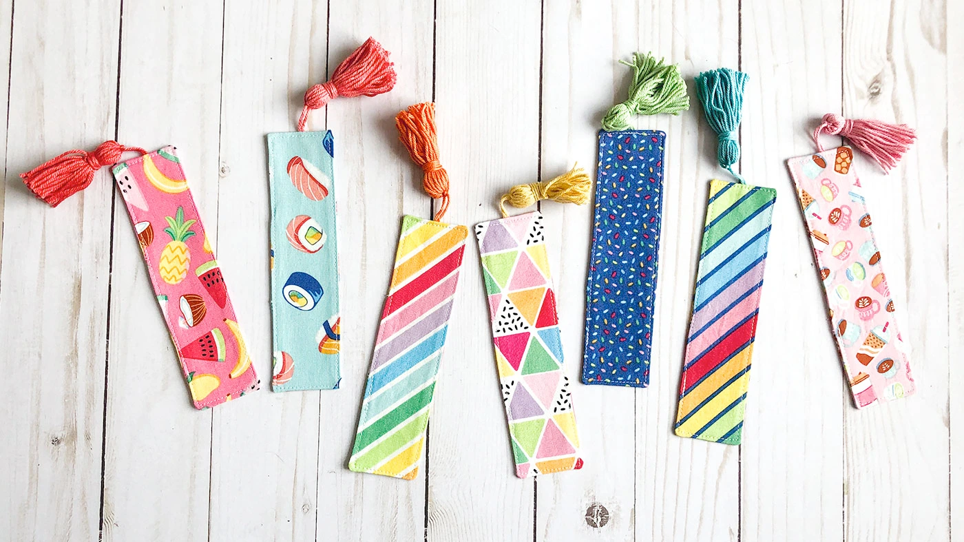 sewn DIY bookmarks on a wooden surface