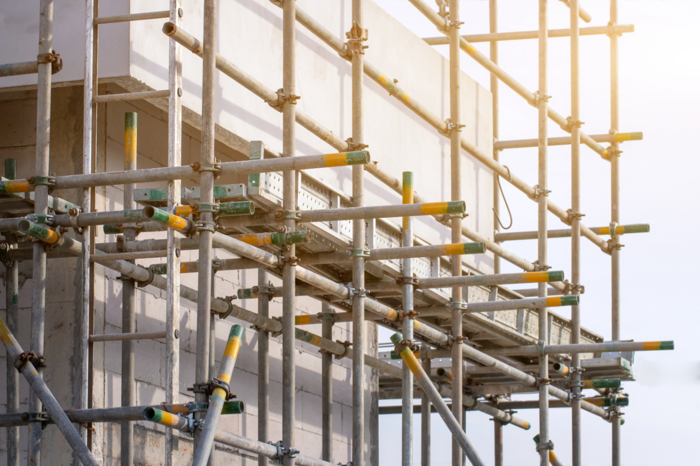 a picture of metal scaffolding wrapped around a cement wall