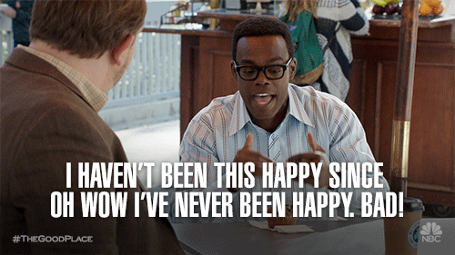 A man in a shirt and glasses (It's Chidi from The Good Place) says to his smiling buddy: "I haven't been this happy since, oh wow, I've never been happy. Bad!"