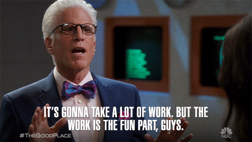 A man in suit and bowtie and glasses (Michael from the Good Place) says: It's gonna take a lot of work, but the work is the fun part, guys.
