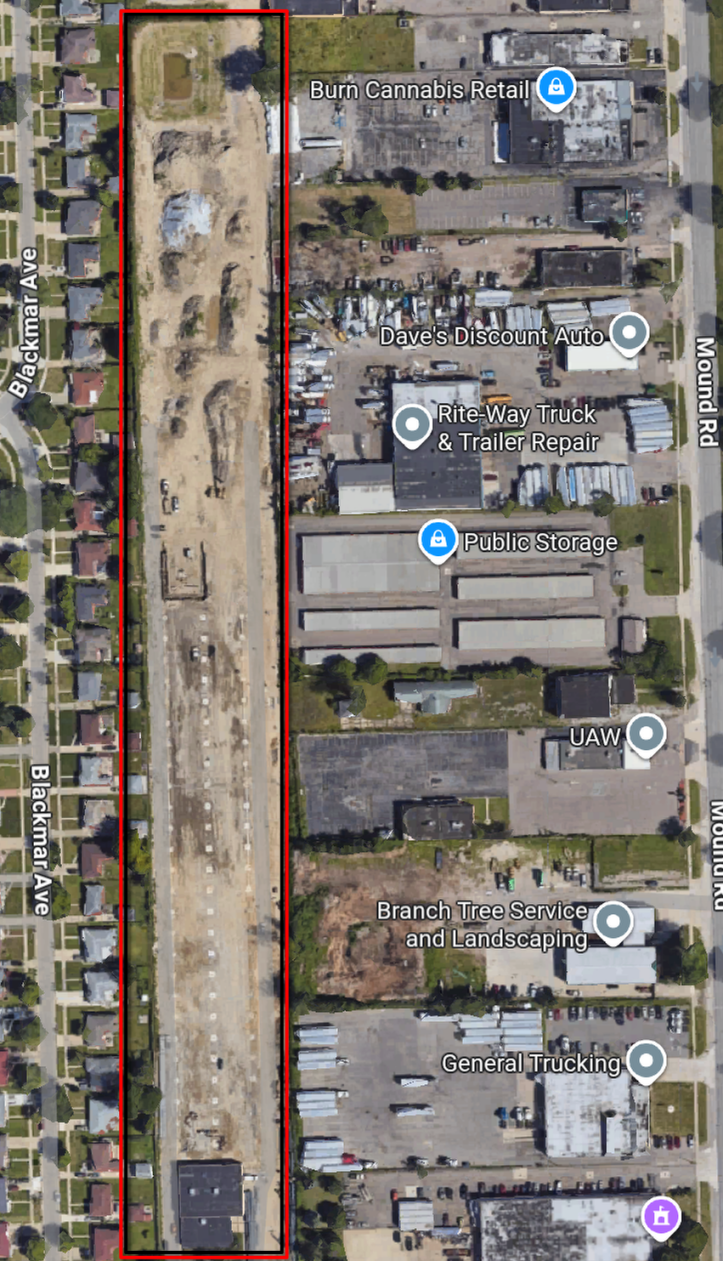 A screenshot of the google maps view of the area mentioned in the article. The area is now just brown dirt, with junk, trailers, and industrial vehicles visible in satellite view. It has been completely destroyed. 