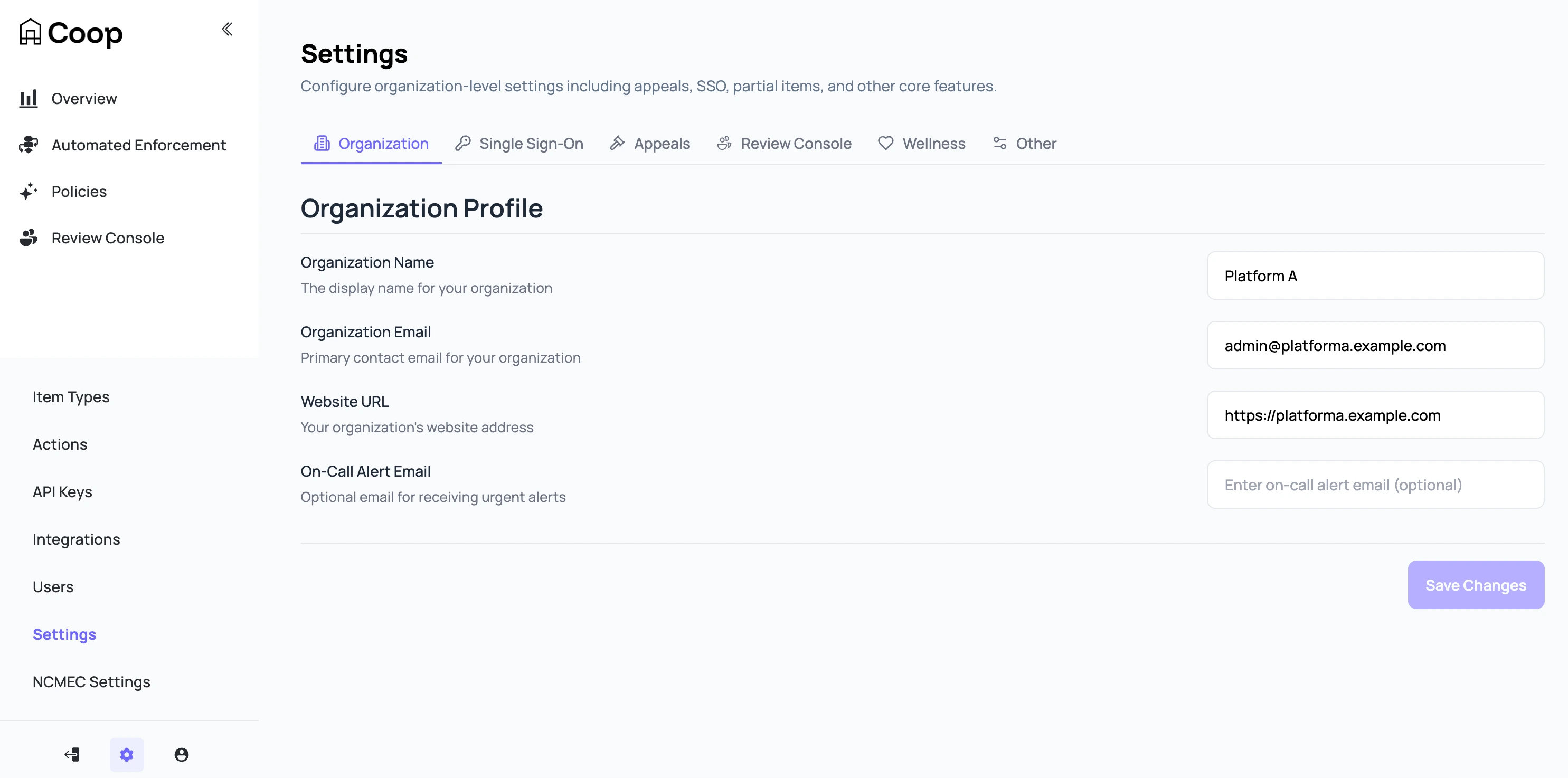 a screenshot of Coop, a review tool for safety teams. The Settings page has 6 tabs: Organization, Single-Sign On, Appeals, Review Console, Wellness, adn Other. The organization profile has fields for the organization name, email, and URL with an on-call alert email. The left menu shows pages for Overview, Automated Enforcement, Policies, Review Console. The settings menu is opened showing places to set Item Types, Actions, API Keys, Integrations, Users, Settings, and NCMEC Settings