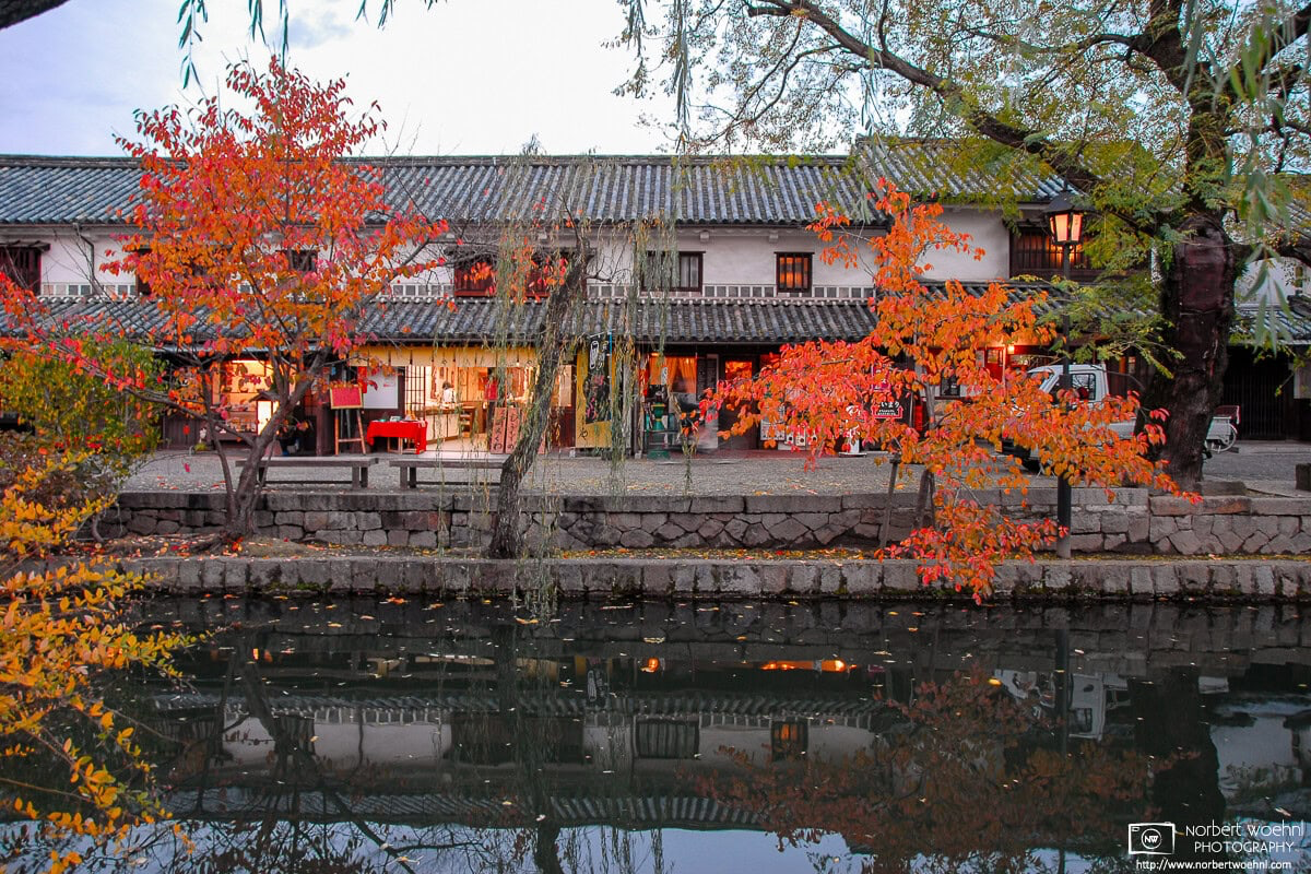 During autumn season, this is a view across the canal in the historic Bikan district of Kurashiki in Okayama Prefecture, Japan. © 2006 Norbert Woehnl Photography.