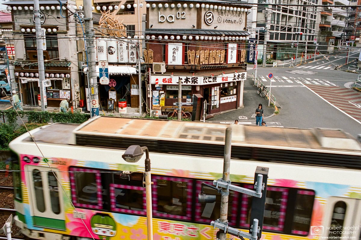 Old Restaurants around Ōtsuka Station in Tokyo, Japan. The train in front is a Toden Arakawa Line that was re-branded as “Tokyo Sakura Tram” in 2017. © 2018 Norbert Woehnl Photography.