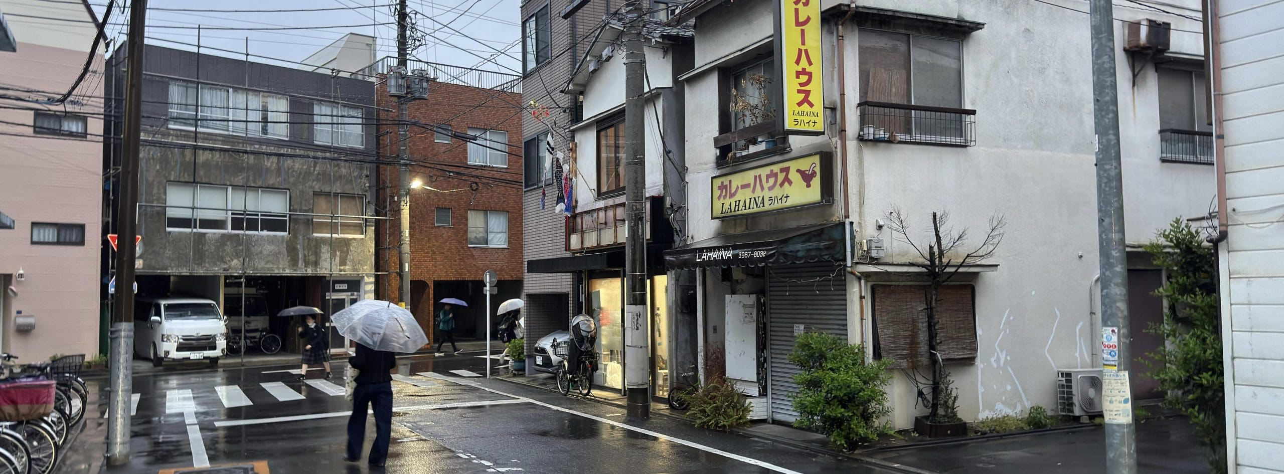 Rainy backstreet evening photo from Itabashi Ward in Tokyo, Japan - residential buildings and curry restaurant. © 2026 Norbert Woehnl Photography.