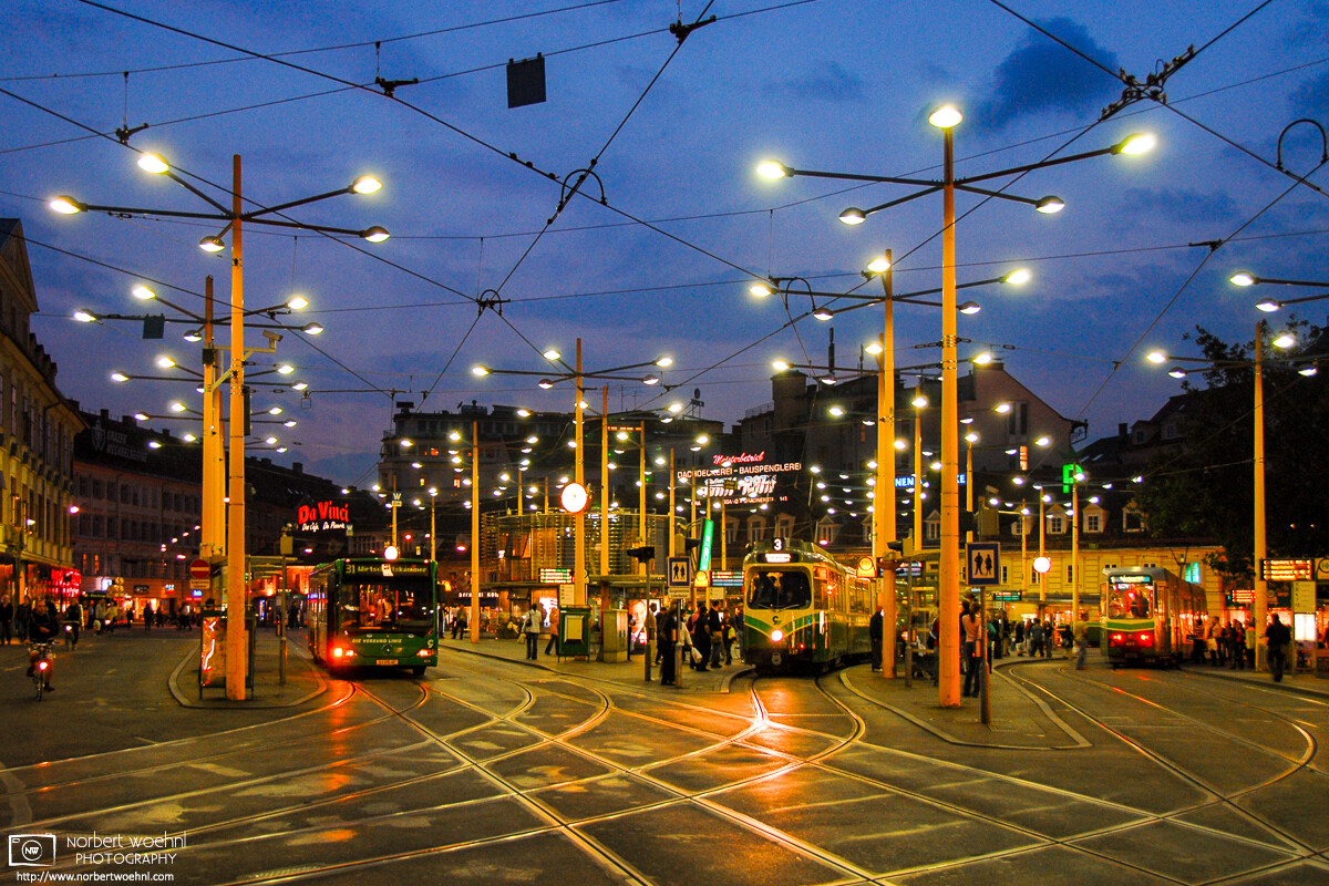 Evening mood at Jakominiplatz (Jakomini Square), a major public transportation hub in the city of Graz, Austria. © 2006 Norbert Woehnl Photography.