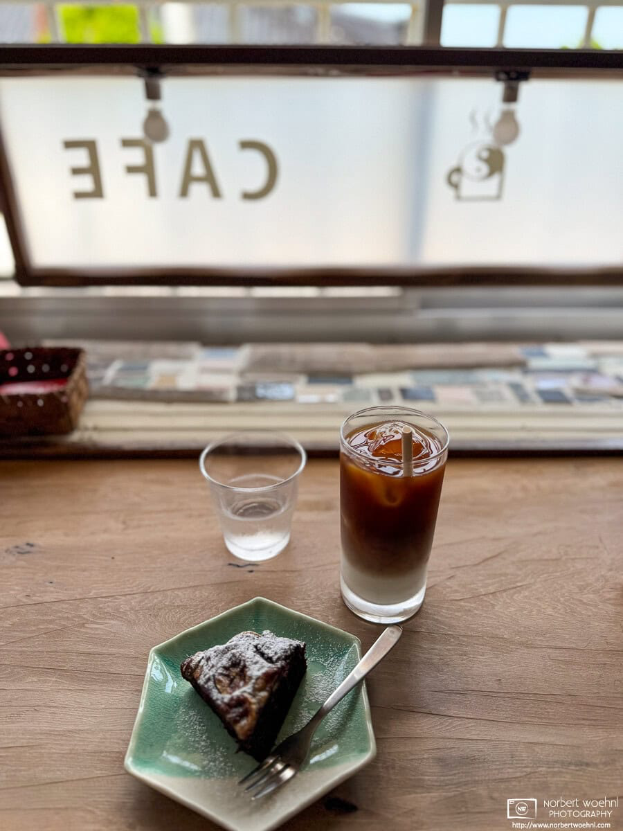 Gluten-free banana-cocoa cake and Iced Caffe Latte at Idohado Doughnuts in Hakodate, Japan. © 2025 Norbert Woehnl Photography.