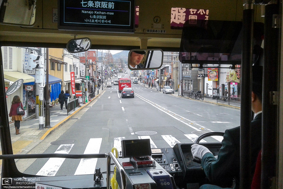View through the front window of a city bus in Kyoto, Japan, looking over the driver's shoulder. © 2012 Norbert Woehnl Photography.
