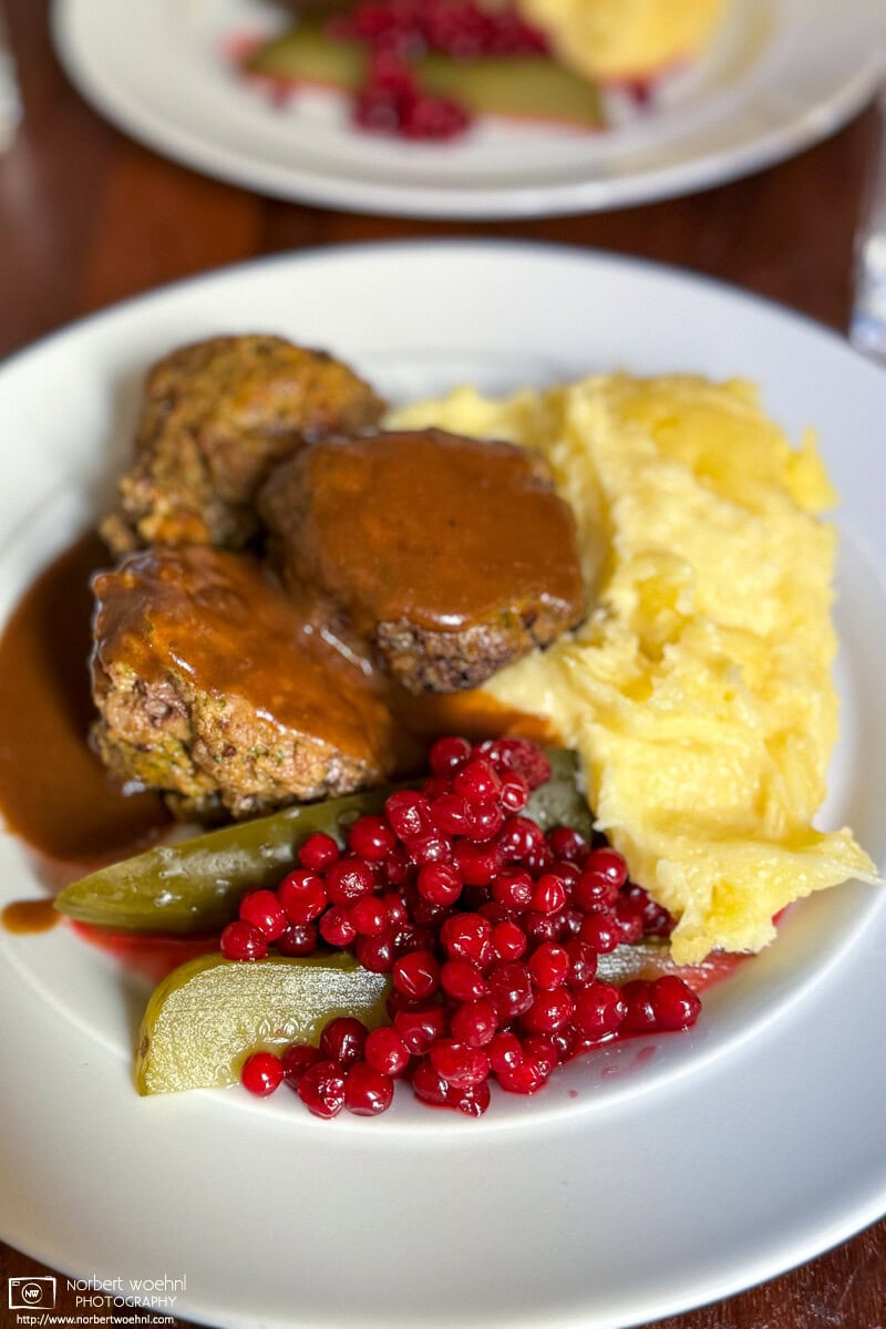 Meatballs with mashed potatoes and lingonberries at Cafe Engel in Helsinki, Finland. © 2024 Norbert Woehnl Photography.