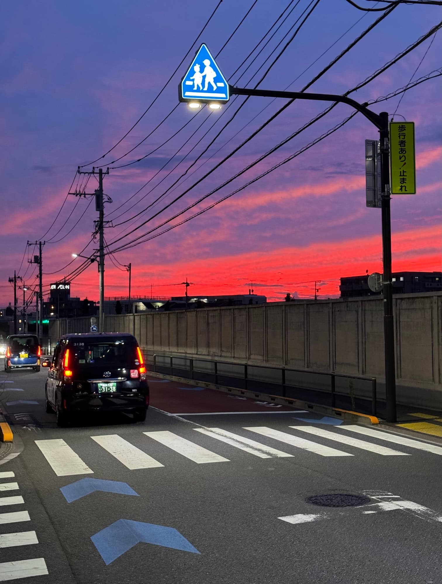 Red and purple summer evening sky in a residential neighborhood of Itabashi Ward in Tokyo, Japan. © 2025 Norbert Woehnl Photography.