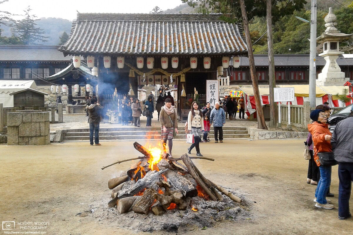 13 years ago today, I went for Hatsumode (first shrine visit of the New Year) at Kibitsuhiko Shrine in Okayama, Japan. A warming fire welcomed me at the gate. © 2013 Norbert Woehnl Photography.
