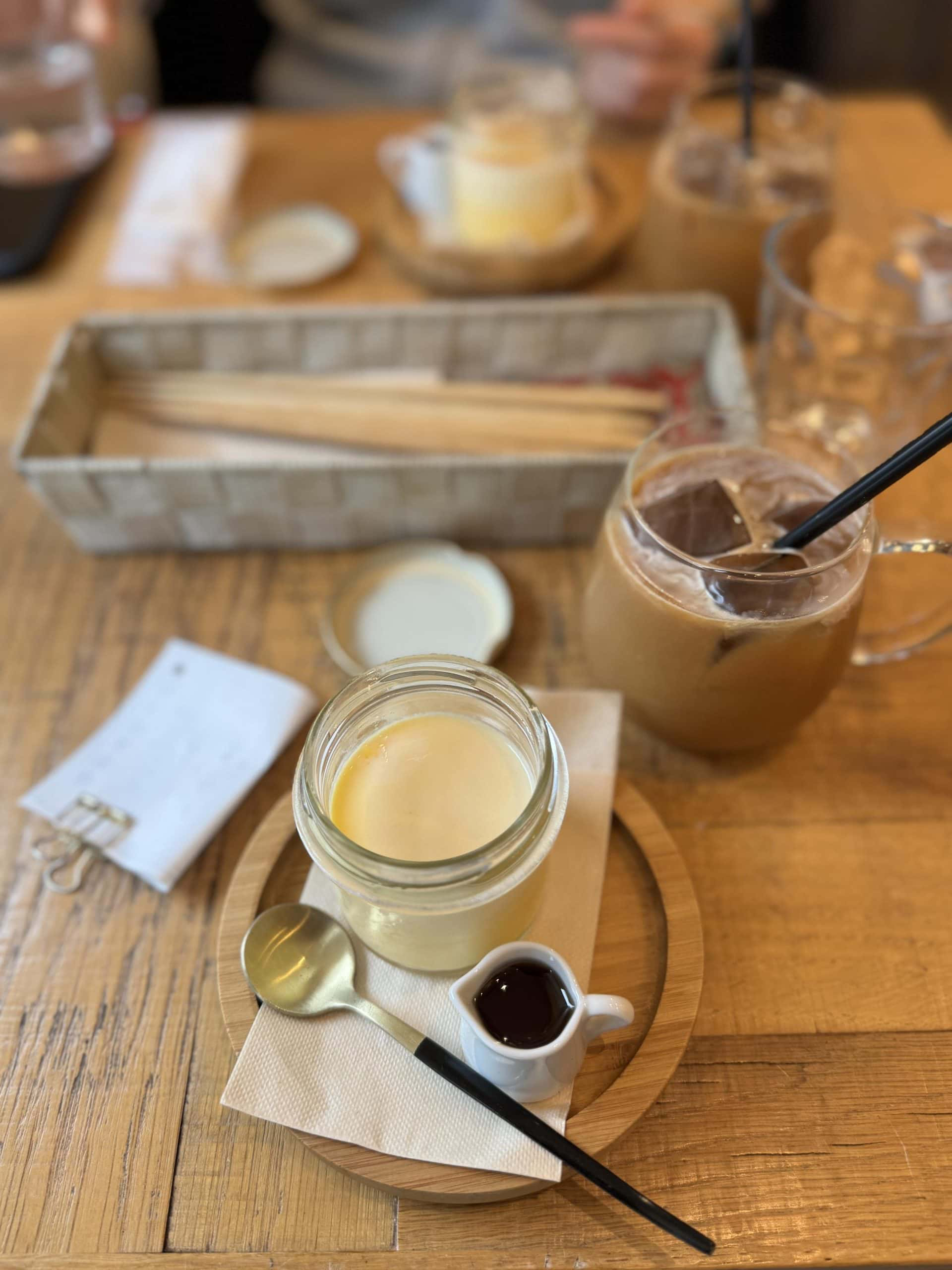 Pudding and iced coffee at Akabane Cafe にじいろのひつじ in Tokyo, Japan. © 2026 Norbert Woehnl Photography.