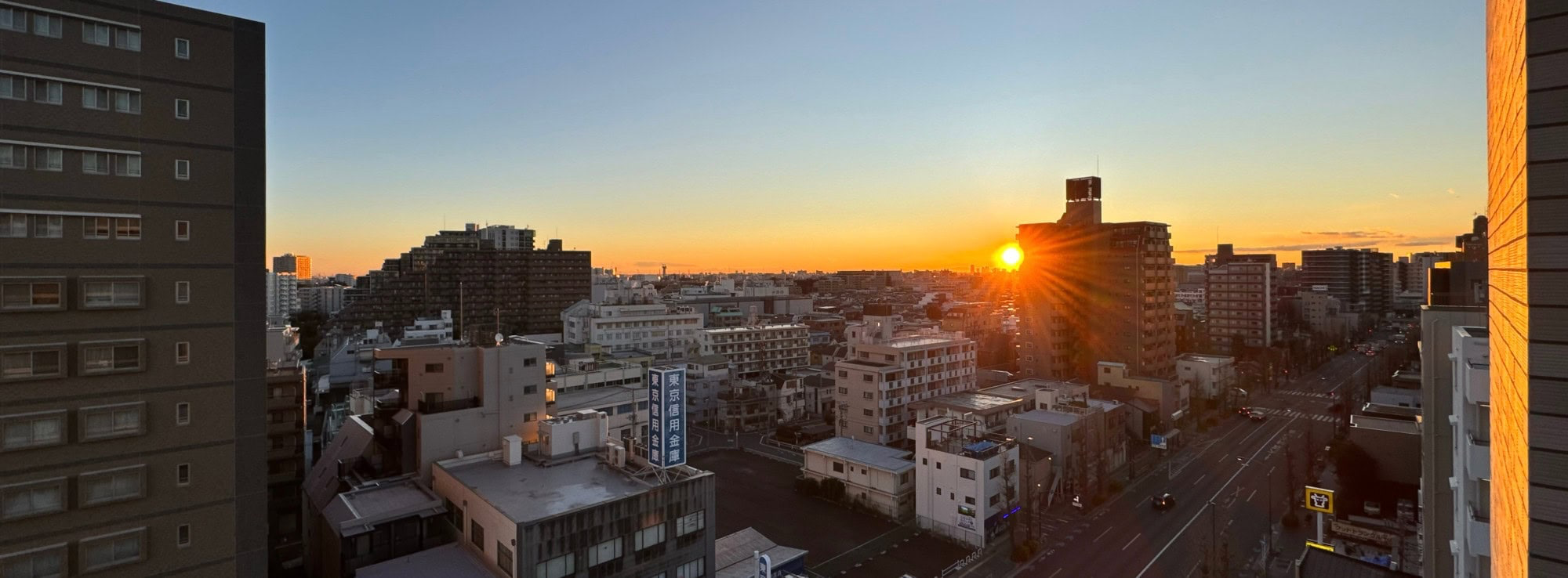 On a clear and crisp January morning, the sun is rising over a suburban scenery in the Itabashi Ward of Tokyo, Japan. © 2026 Norbert Woehnl Photography.