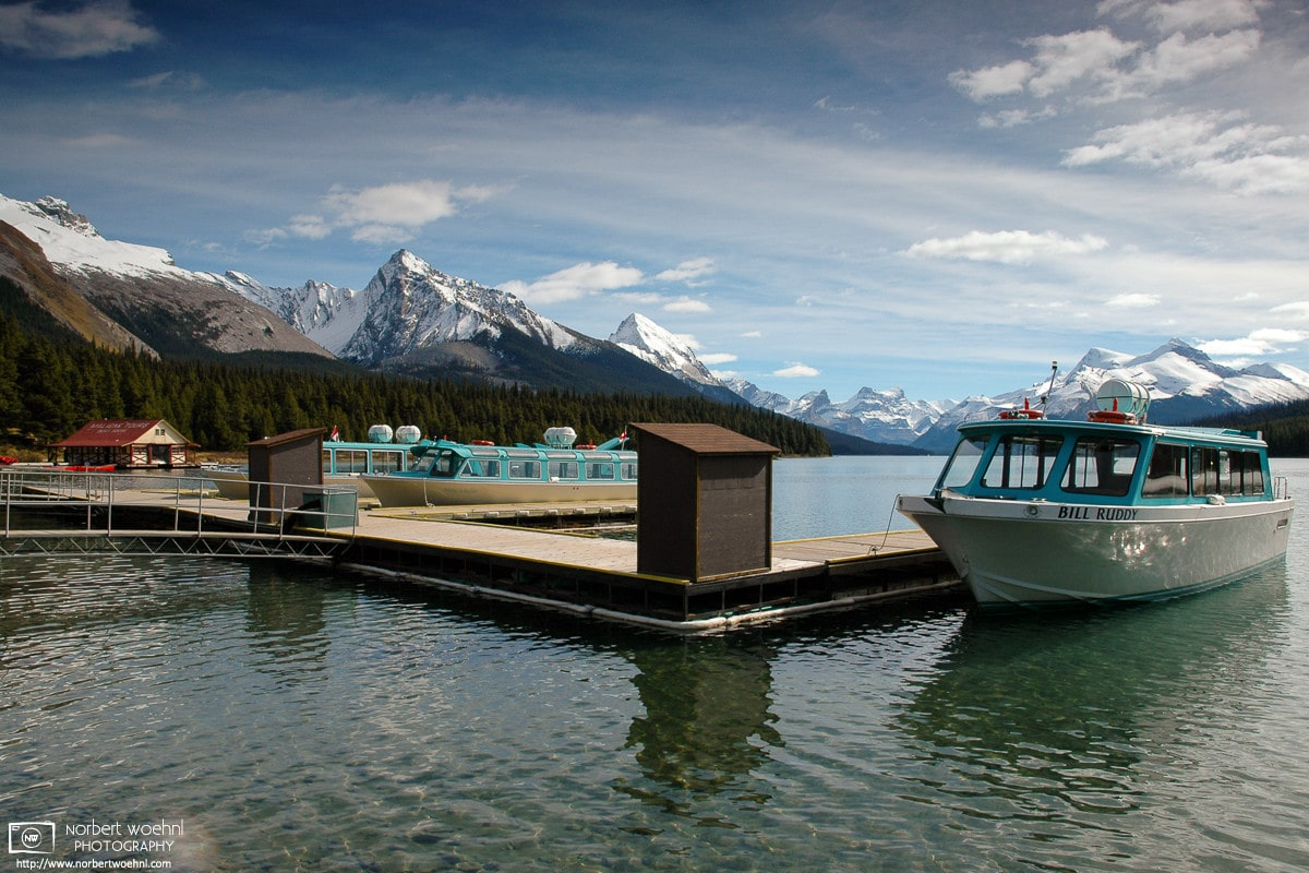 Spirit Island Tour Boats are on standby near Maligne Lake Boathouse in Jasper National Park, Alberta, Canada. © 2005 Norbert Woehnl Photography.