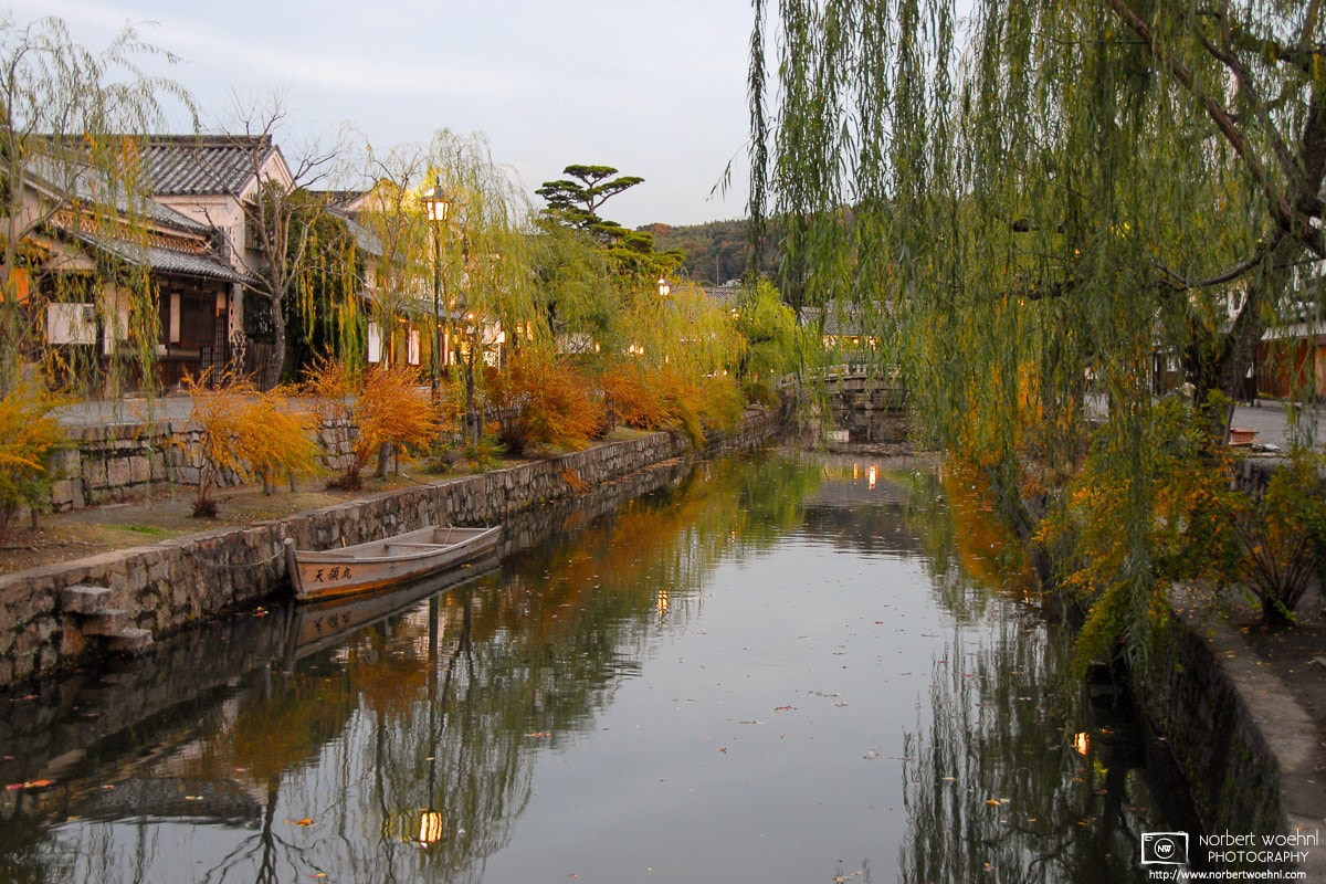 In the Bikan district of Kurashiki in Okayama Prefecture, Japan, trees along the canal have changed to autumn colors. © 2006 Norbert Woehnl Photography.