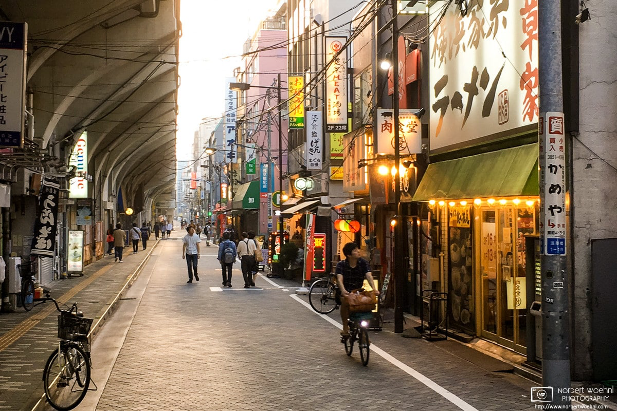 Late-afternoon passers-by are checking out Ramen restaurants in the Asakusabashi area of Tokyo, Japan. © 2018 Norbert Woehnl Photography.