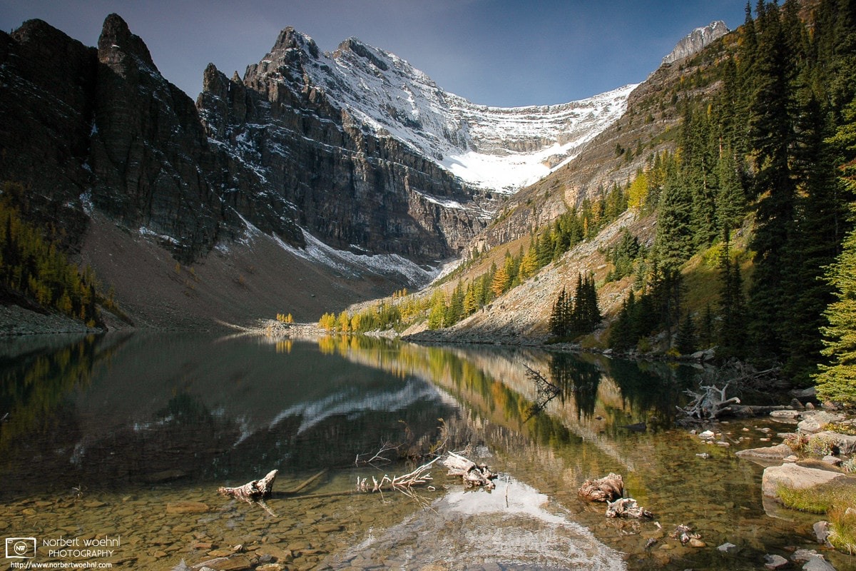 Lake Agnes is a beautiful alpine lake in Banff National Park, Alberta, set inside a cirque formed by the peaks of Mt. Saint Piran, Mt. Niblock, and Mt. Whyte. © 2005 Norbert Woehnl Photography.
