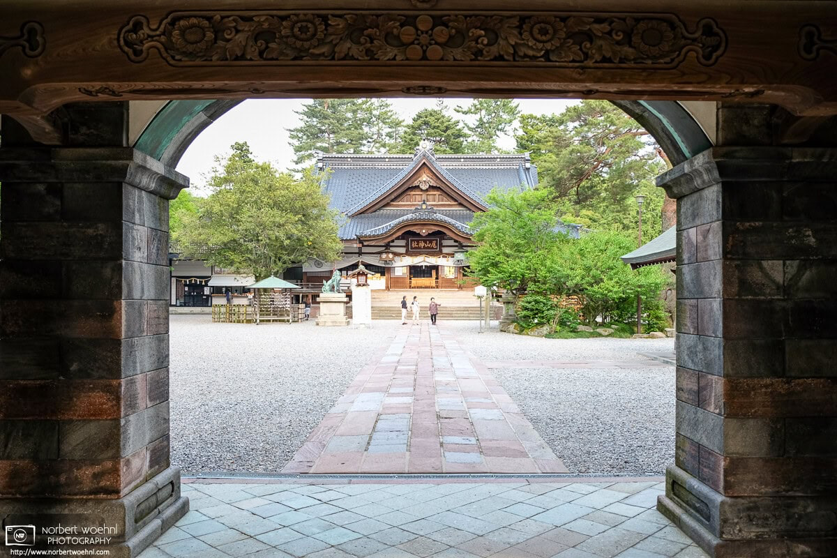 A view towards the Main Hall of Oyama Jinja in Kanazawa, Japan, while entering the main yard through the shrine’s distinctive Main Gate. © 2015 Norbert Woehnl Photography.