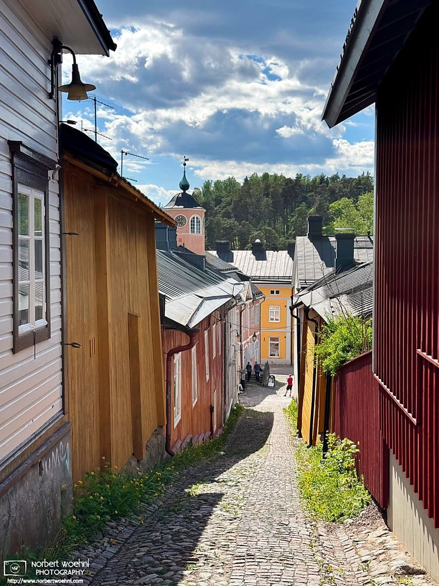 View of historic buildings along Ralinginkuja, an alley in the historic district of Porvoo, Finland. © 2026 Norbert Woehnl Photography.