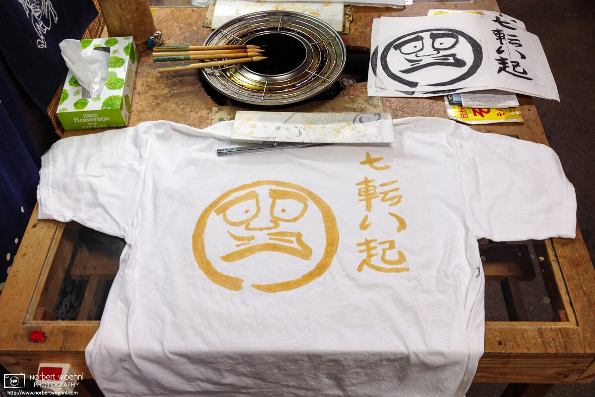 A finished wax design that has been painted on a white t-shirt at a traditional indigo-dyeing shop in Kyoto, Japan. © 2014 Norbert Woehnl Photography.