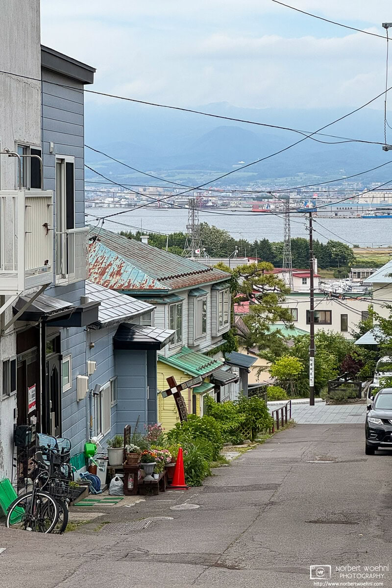 Walking on a backstreet of the historic Motomachi district of Hakodate in southern Hokkaido, Japan. © 2025 Norbert Woehnl Photography.