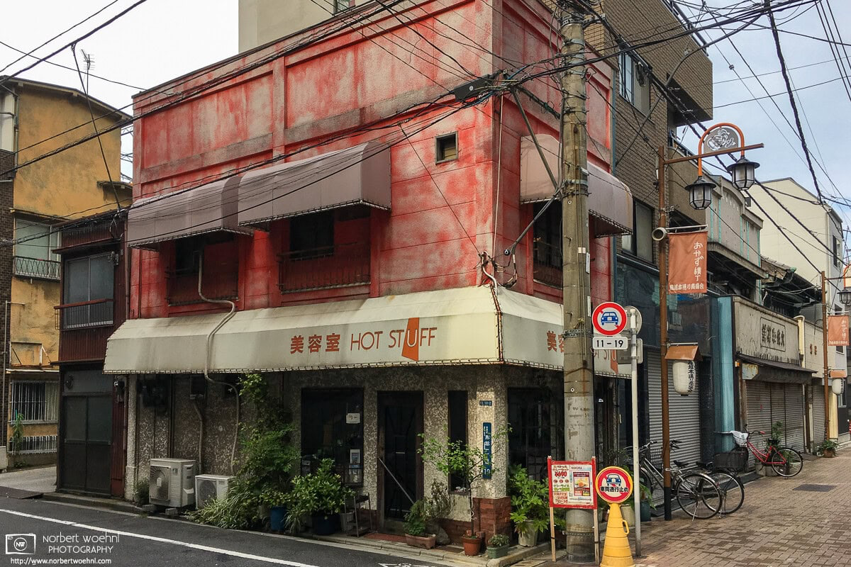 An ambitiously-named hairdresser and beauty salon in a beautifully weathered old building in the Taito Ward of Tokyo, Japan. © 2018 Norbert Woehnl Photography.