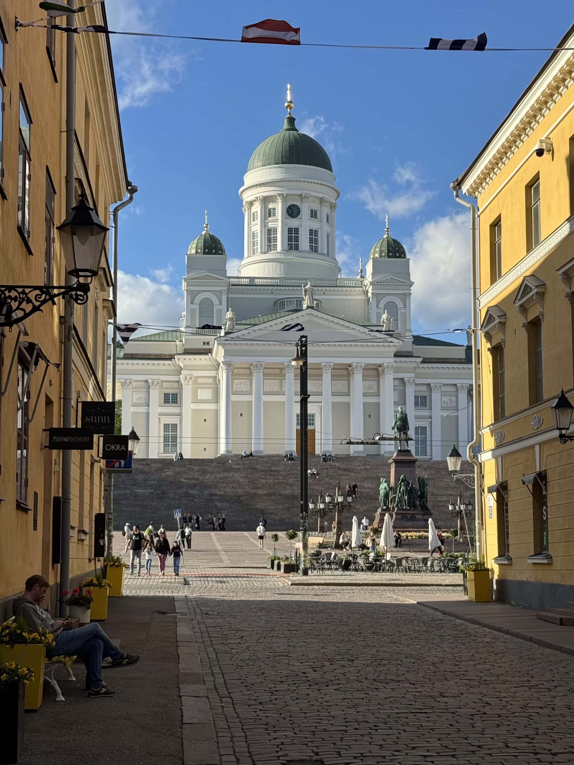 Evening view of Helsinki Cathedral and Senate Square from Sofiankatu, a cobblestone street lined with old buildings. © 2026 Norbert Woehnl Photography.