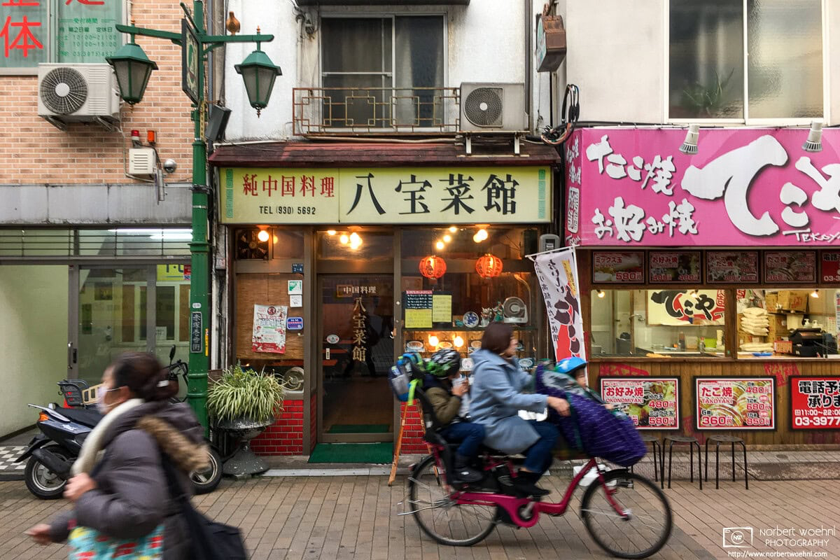 Light traffic outside an old Chinese restaurant in the Shimo-Akatsuka area of Itabashi Ward in Tokyo, Japan. © 2018 Norbert Woehnl Photography.