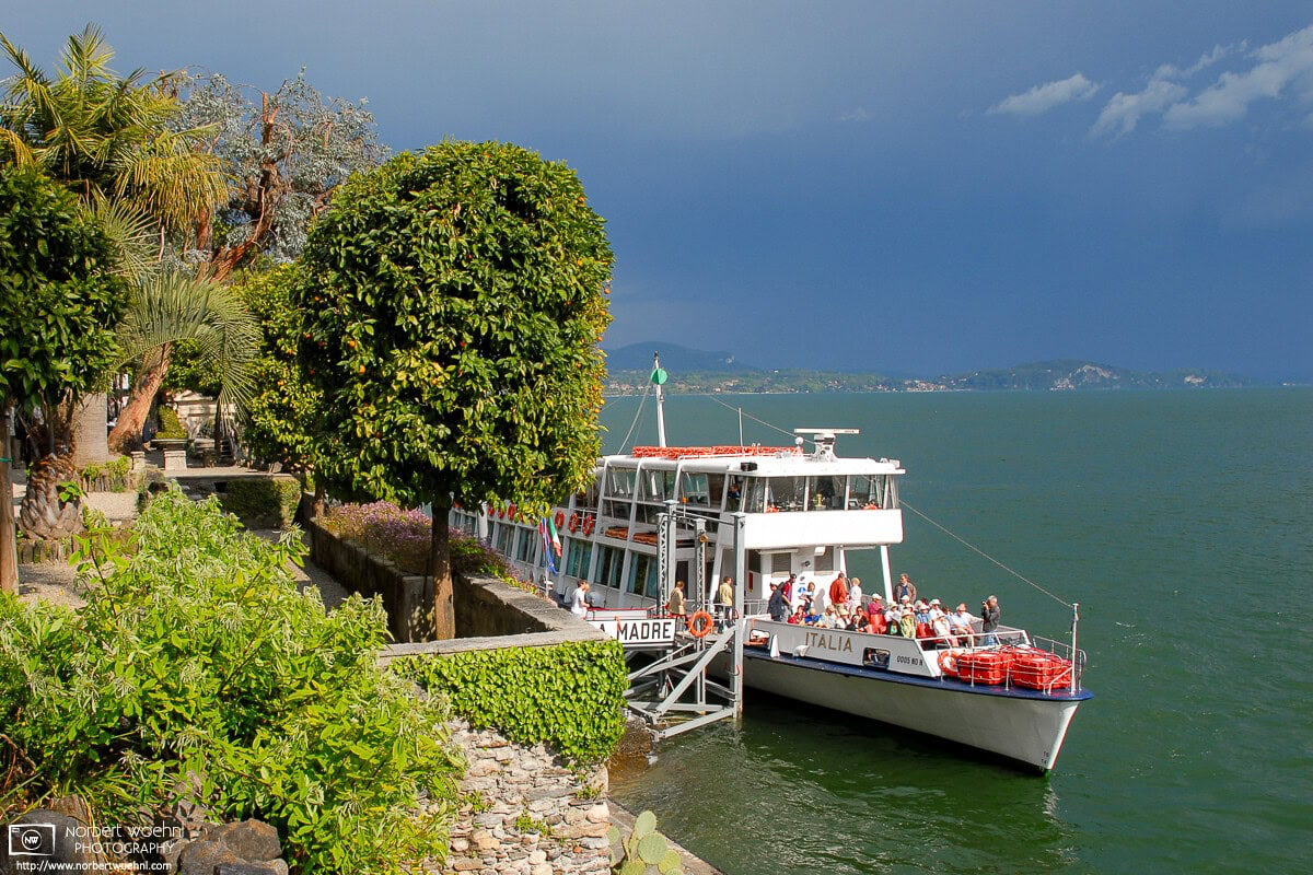 An excursion boat is getting ready for departure from Isola Madre, one of the three Isole Borromee inside Lago Maggiore, Italy. © 2006 Norbert Woehnl Photography.