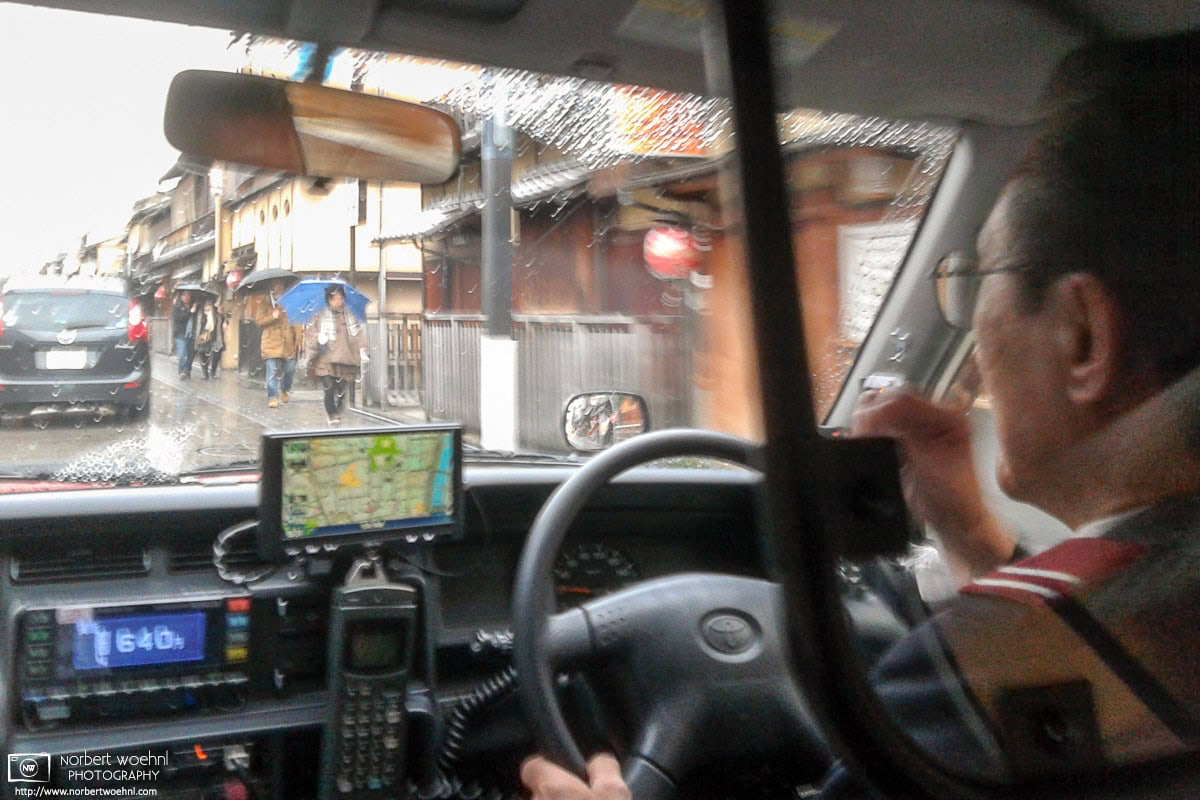 During heavy rain in Kyoto, Japan, this photo was taken on a taxi ride through the Gion district. © 2012 Norbert Woehnl Photography.