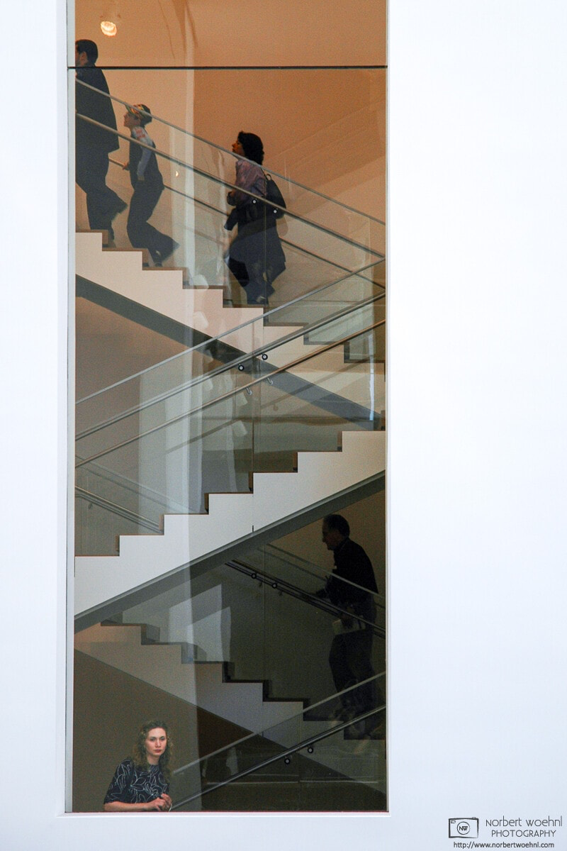 A visitor looks through a window at the Museum of Modern Art (MoMA) in New York City. © 2005 Norbert Woehnl Photography.