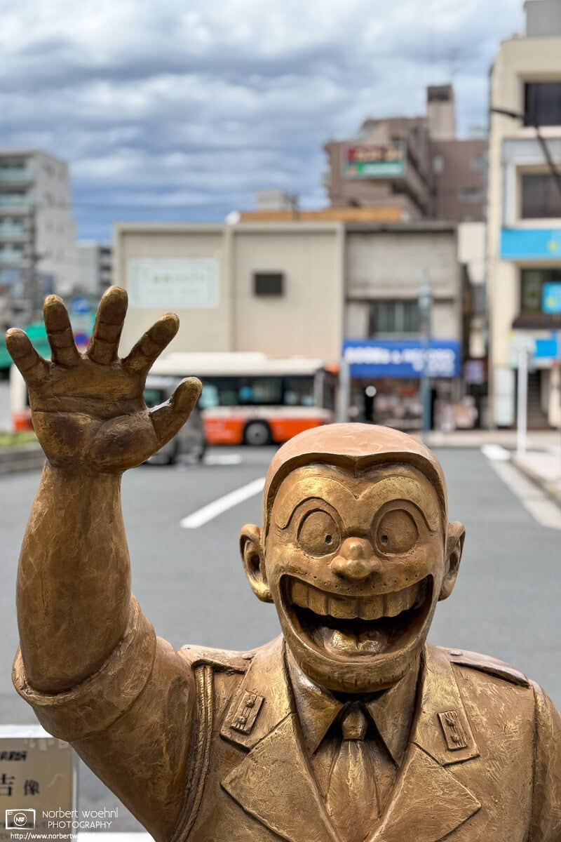 Statue of Kankichi Ryōtsu outside JR Kameari Station in Tokyo, Japan. © 2025 Norbert Woehnl Photography.