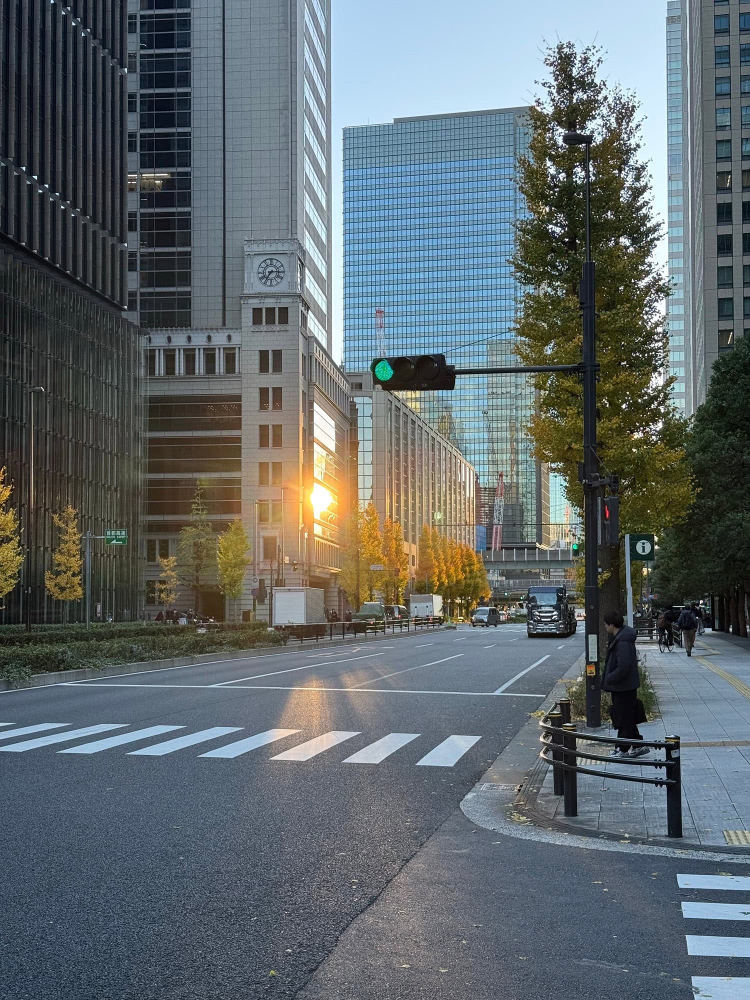 December morning sunlight and a few autumn colors amidst high-rise office buildings in the Marunouchi/Otemachi area of Tokyo, Japan. © 2025 Norbert Woehnl Photography.