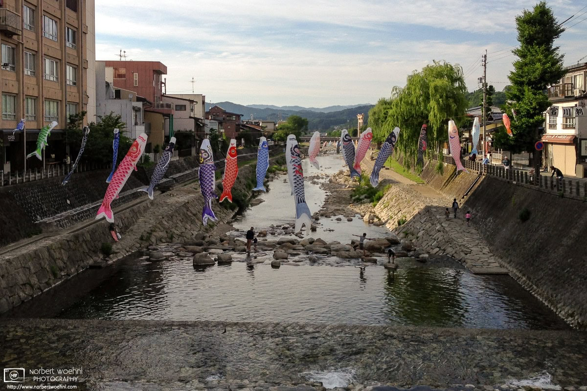 Koinobori (carp-shaped windsocks) are hung across the Miyagawa River in the city of Takayama, Gifu Prefecture, Japan. © 2015 Norbert Woehnl Photography.