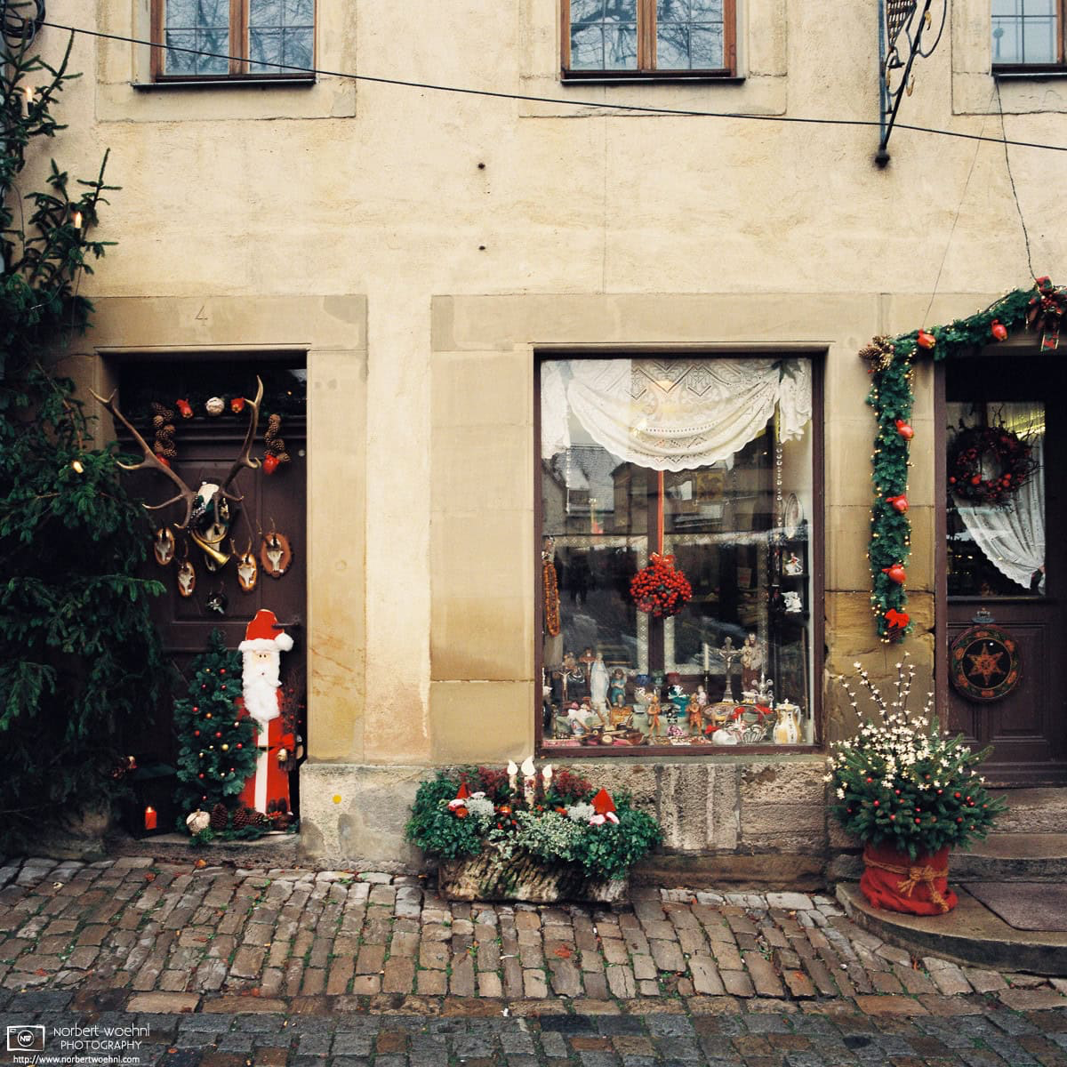 A store in Rothenburg ob der Tauber in the south-German state of Bavaria is decorated for the Christmas season. © 2015 Norbert Woehnl Photography.