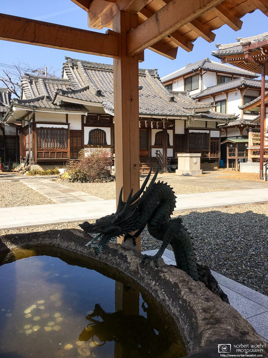 The intricate purification fountain at Myokeiji, a beautiful small temple northeast of Ikebukuro Station in the Toshima Ward of Tokyo, Japan. © 2019 Norbert Woehnl Photography.