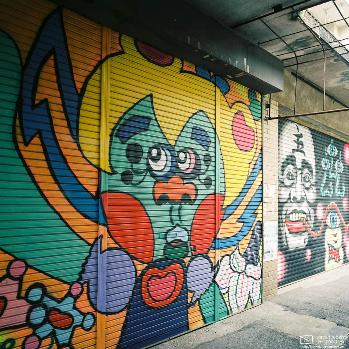 Colorful graffiti-style paintings on the shutters of shops at Kirigaoka Shopping Street in Tokyo, Japan. © 2021 Norbert Woehnl Photography.