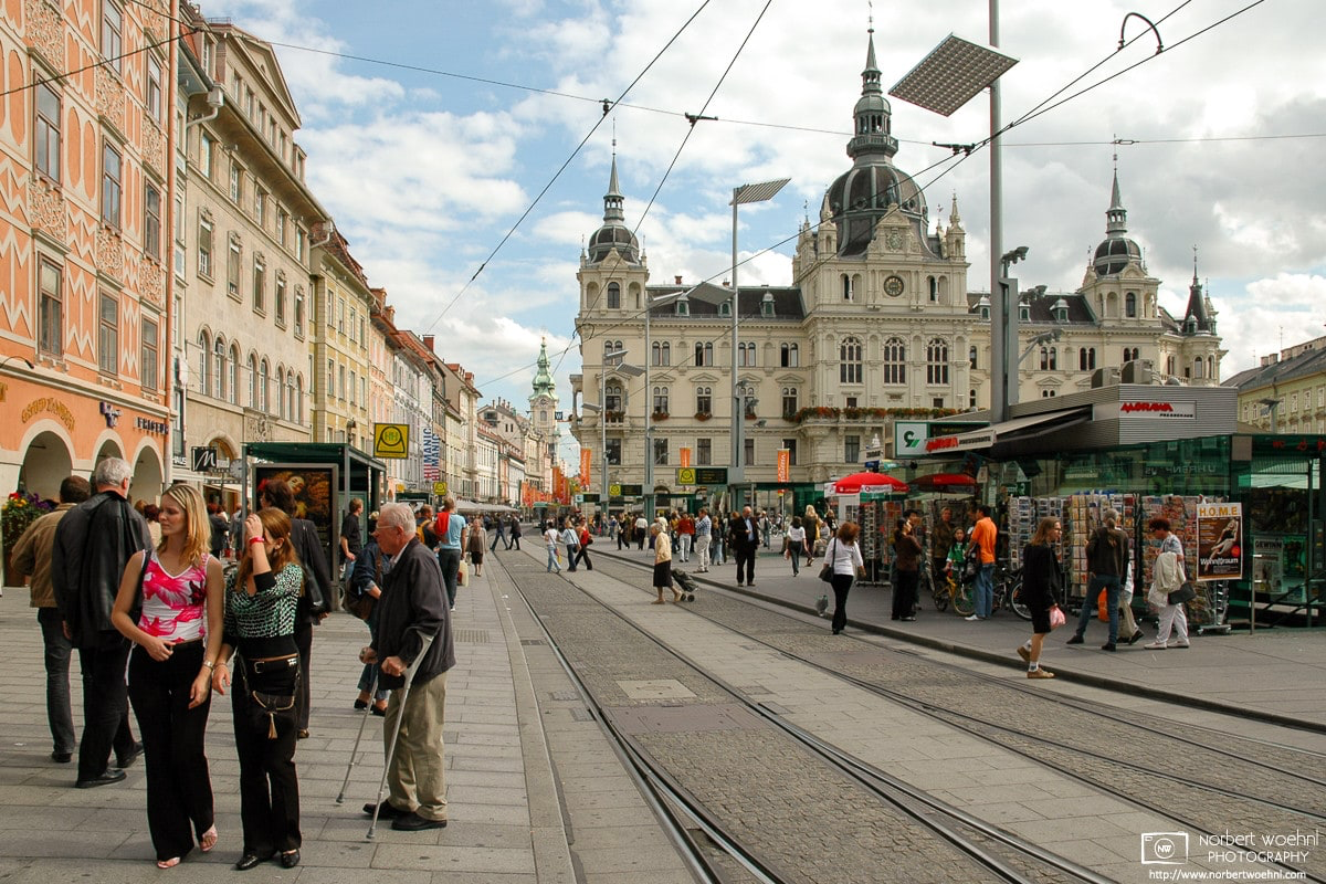 Scene on Hauptplatz (Central Square) in the historic city center of Graz, Austria, with City Hall prominently visible in the background. © 2004 Norbert Woehnl Photography.
