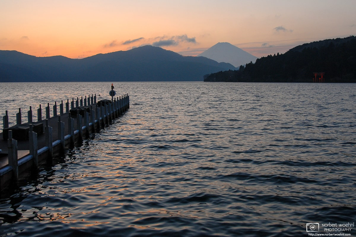 Looking across Lake Ashi in Hakone, Japan, on a late afternoon, with Mount Fuji visible in the background. © 2007 Norbert Woehnl Photography.