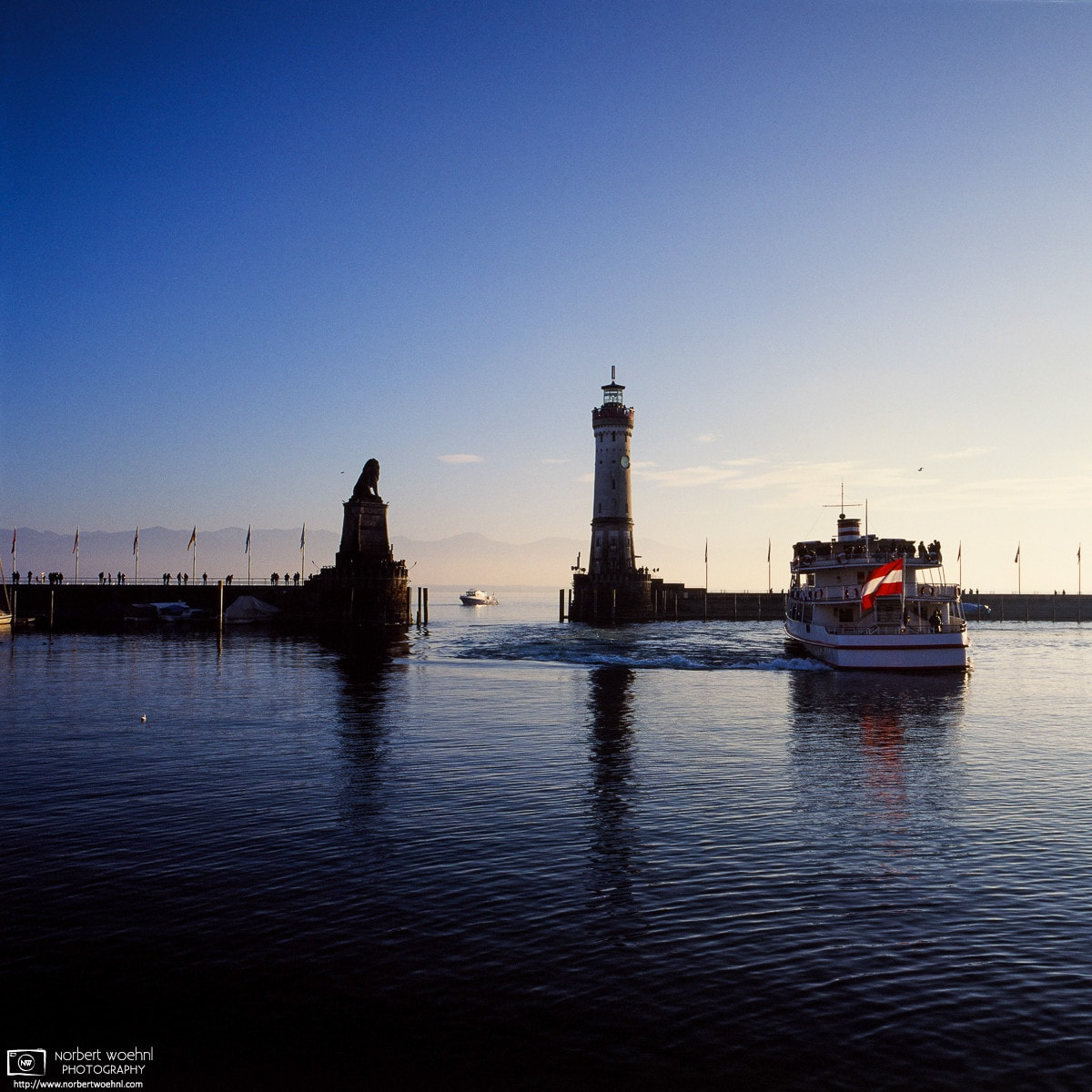 Late-afternoon boat traffic on Lake Constance (Bodensee) in the harbor of Lindau, Germany. © 2016 Norbert Woehnl Photography.