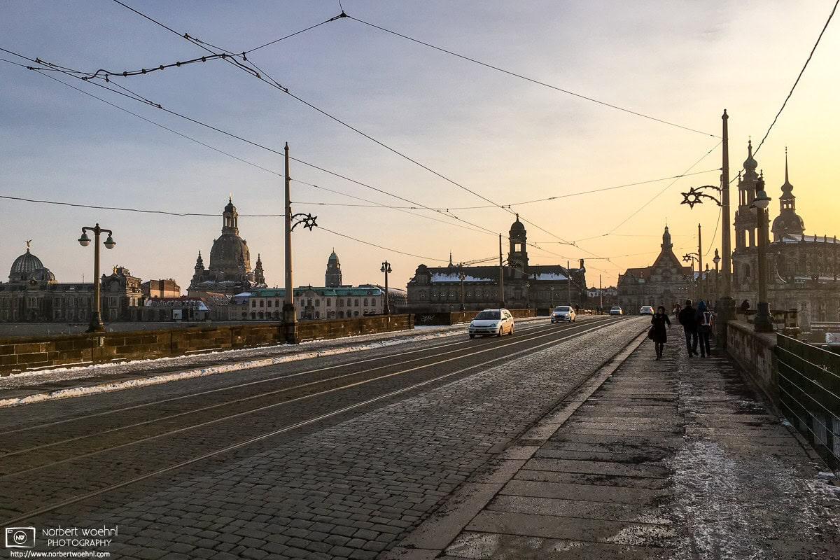 A winter view across Augustusbrücke (Augustus Bridge) in Dresden, Germany. The dome of Frauenkirche is visible at the left. © 2017 Norbert Woehnl Photography.