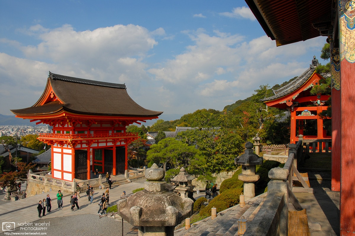People are ascending to Kiyomizudera in Kyoto, Japan, passing the Niomon Gate of the famous temple. © 2006 Norbert Woehnl Photography.