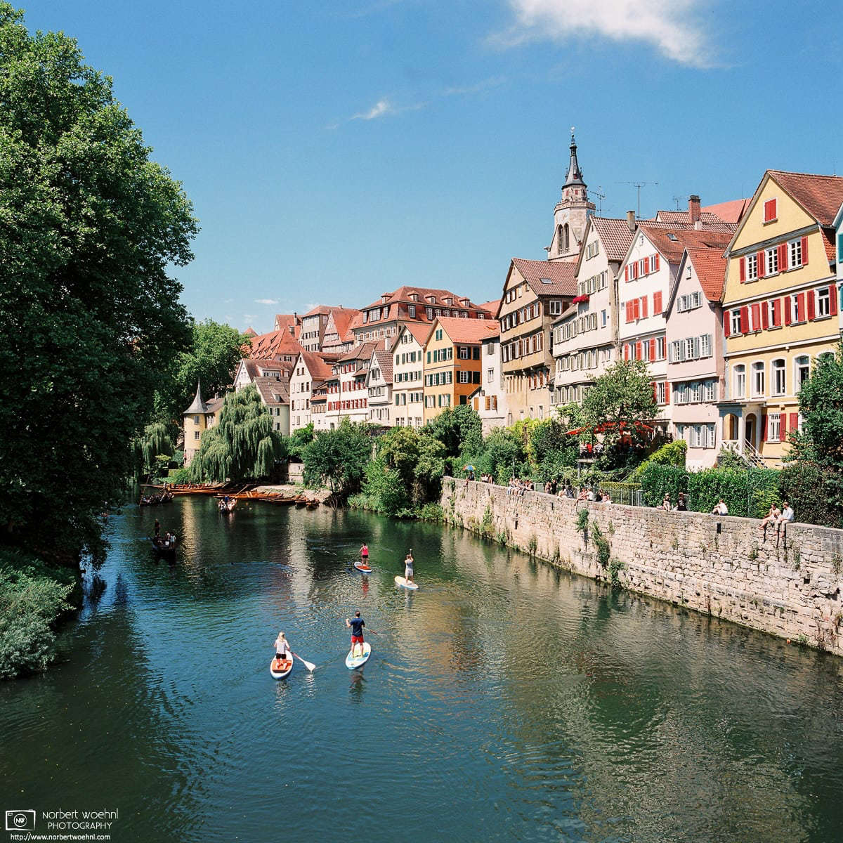 One more photo of the Neckar waterfront in Tübingen, Germany, featuring a view of some of the oldest buildings in the city. In the later afternoon, the Stocherkahn boats have been replaced by individual water traffic. © 2017 Norbert Woehnl Photography.