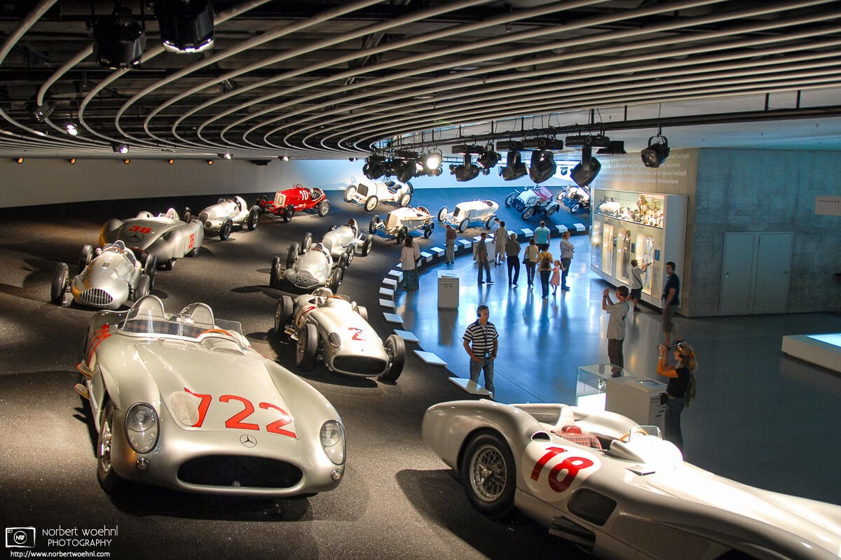 This motor sports history display at the Mercedes-Benz Museum in Stuttgart, Germany, features some of their famous “Silver Arrow” (Silberpfeil) cars. © 2006 Norbert Woehnl Photography.