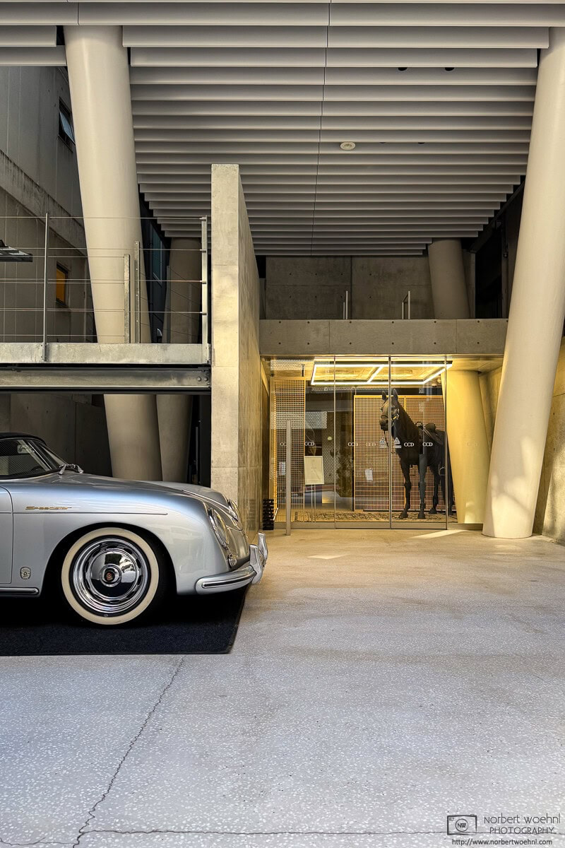 In the Hirakawacho area of Chiyoda Ward in Tokyo, I passed this slightly baffling building entrance featuring a 1950s Porsche 356 Speedster and a horse statue. © 2026 Norbert Woehnl Photography.